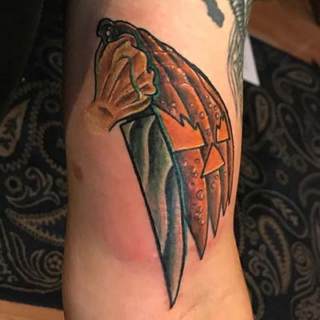 Tattoo: hand with knife