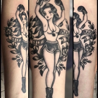 Tattoo: pin up artwork of girl in boxing gloves