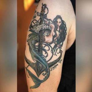 Tattoo: mermaid intertwined around an achor