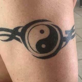 Tattoo: yin yang symbal with tribal