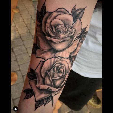 Tattoo: two black and white roses
