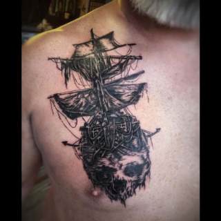 Tattoo: sunken pirate ship and large skull