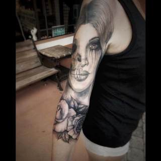 Tattoo: black and white woman's face