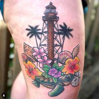 Tattoo: colorful sea turtle and light post